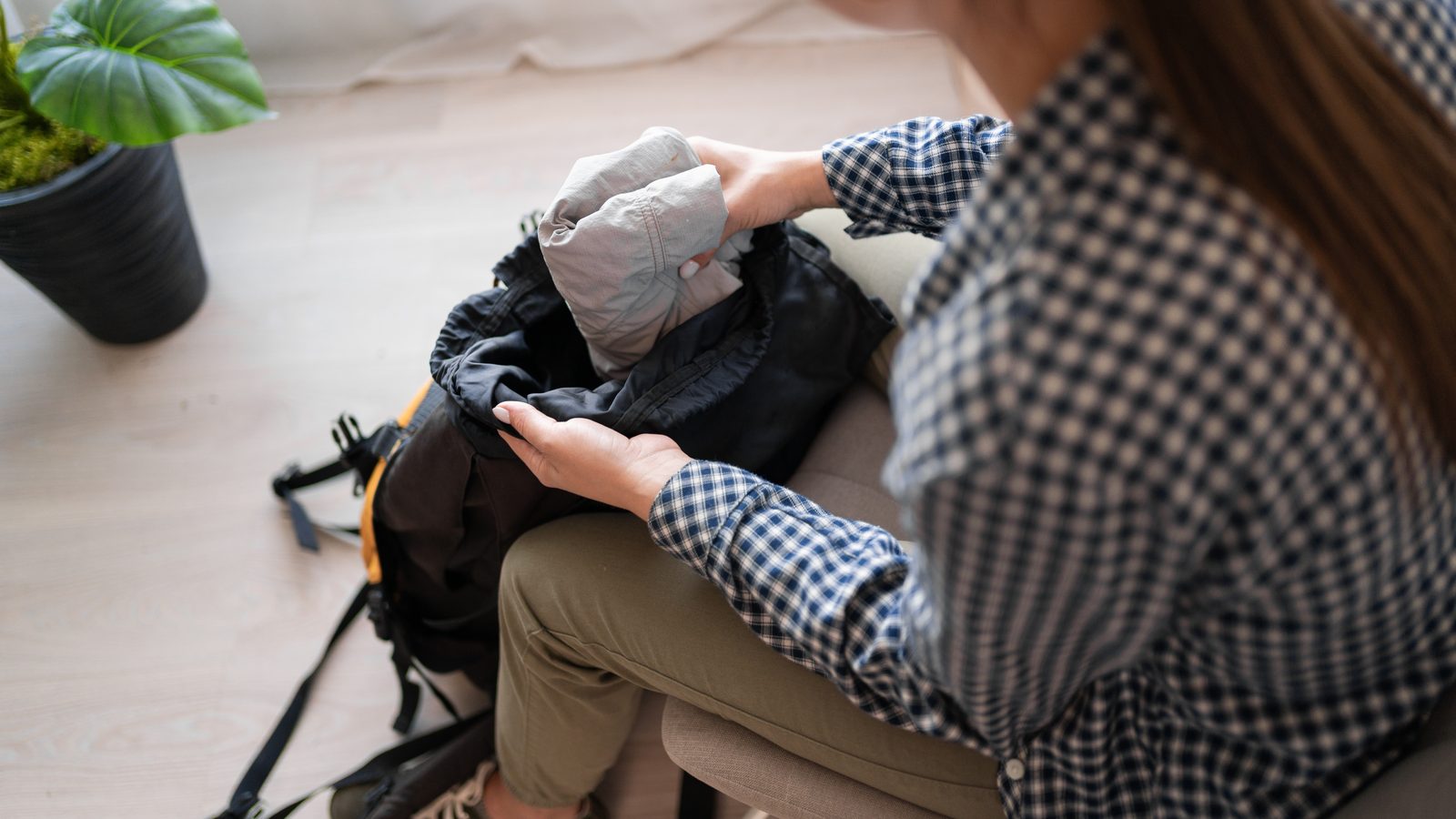 A rucksack being packed indoors