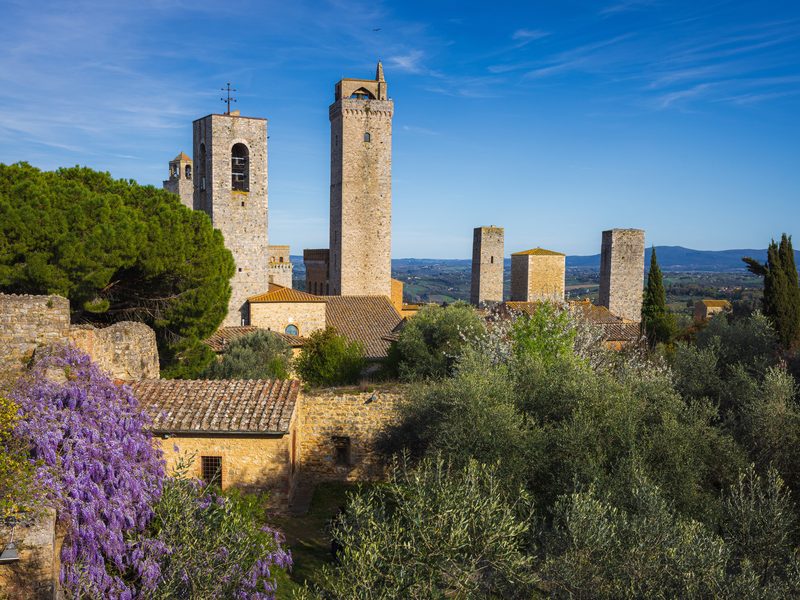 The medieval towers of San Gimignano above the Tuscan hills